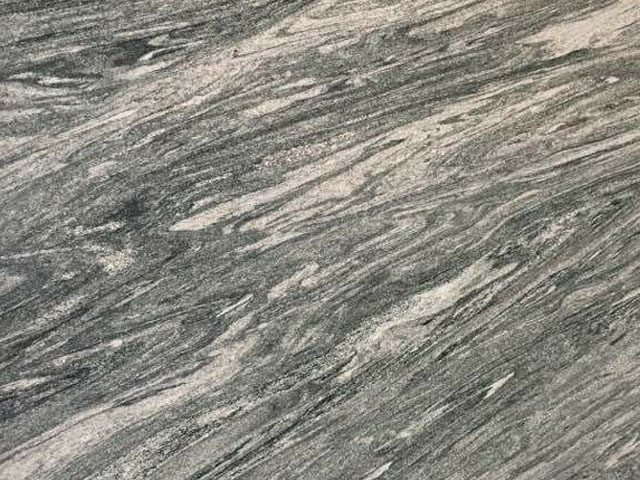 Kuppam Green granite slab — fine-grained grey-green with white streaks